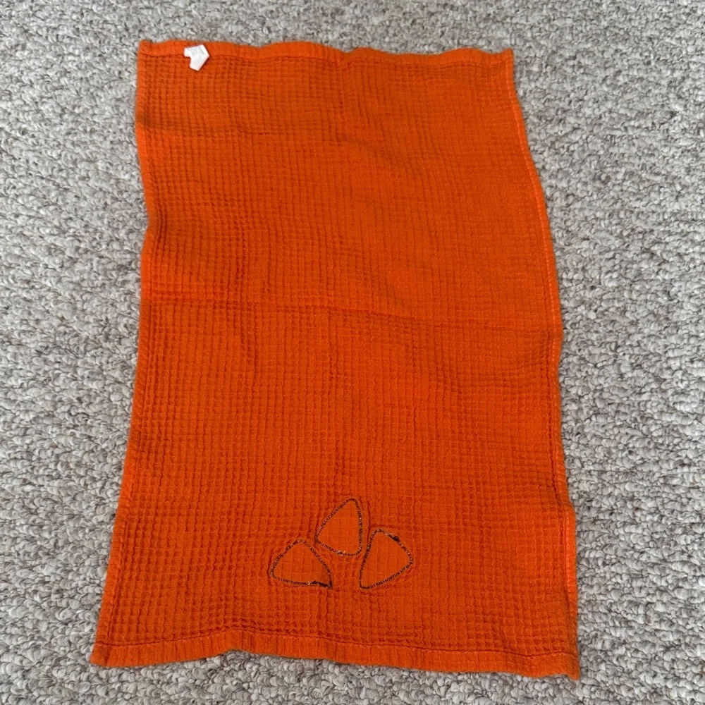 Orange hand towel with Candy Corn Design